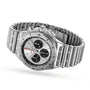 The Breitling Chronomat B01 42, a stainless steel timepiece featuring a silver dial with three black subdials and a signature Rouleaux bracelet, is displayed at an angle.