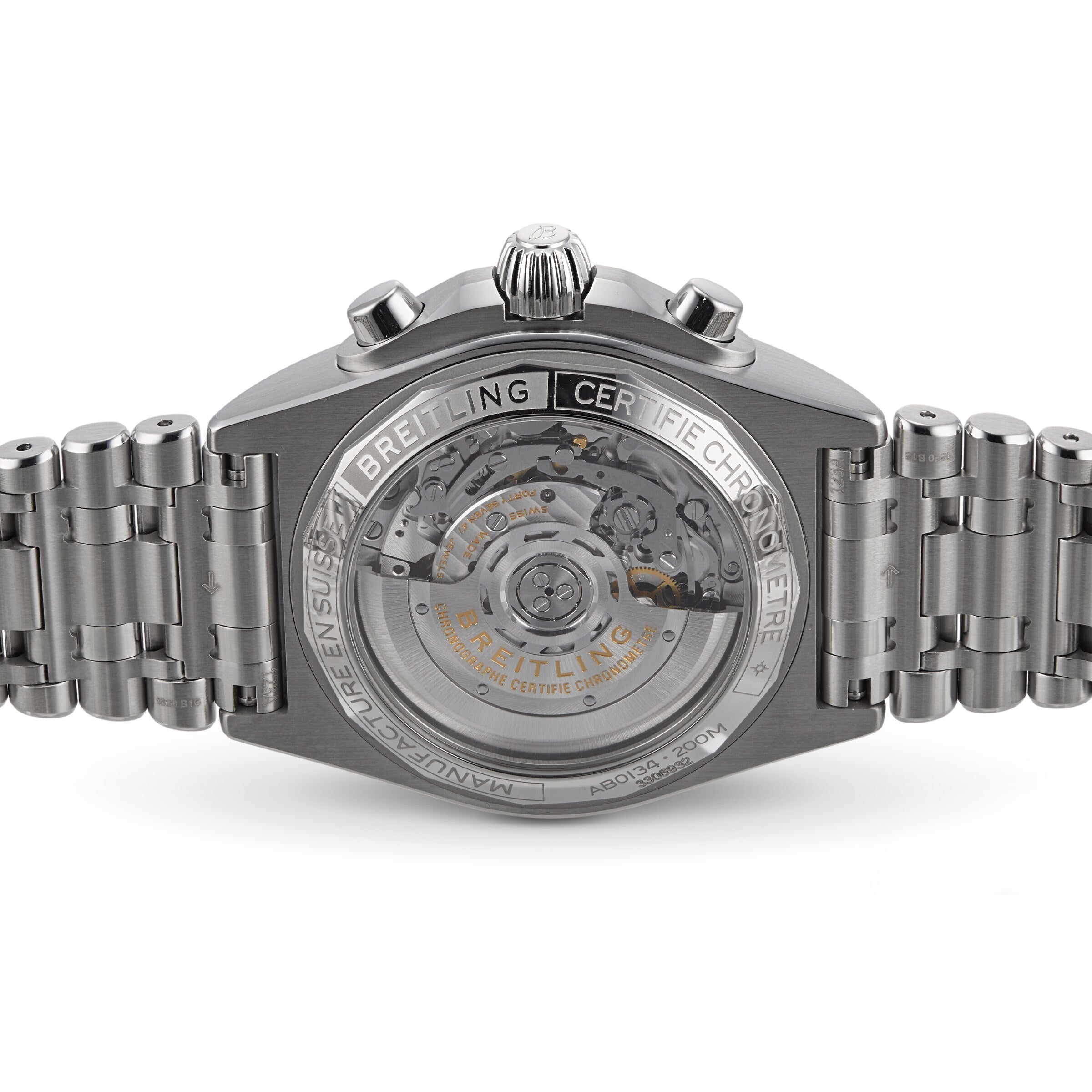 Close-up of the Breitling Chronomat B01 42’s back, highlighting its transparent stainless steel case, intricate inner movement, and detailed engraved markings on the casing and bracelet.