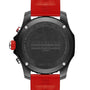 The back of a Breitling Endurance Pro 44 watch with a black case and red strap displays engraved branding and specifications.