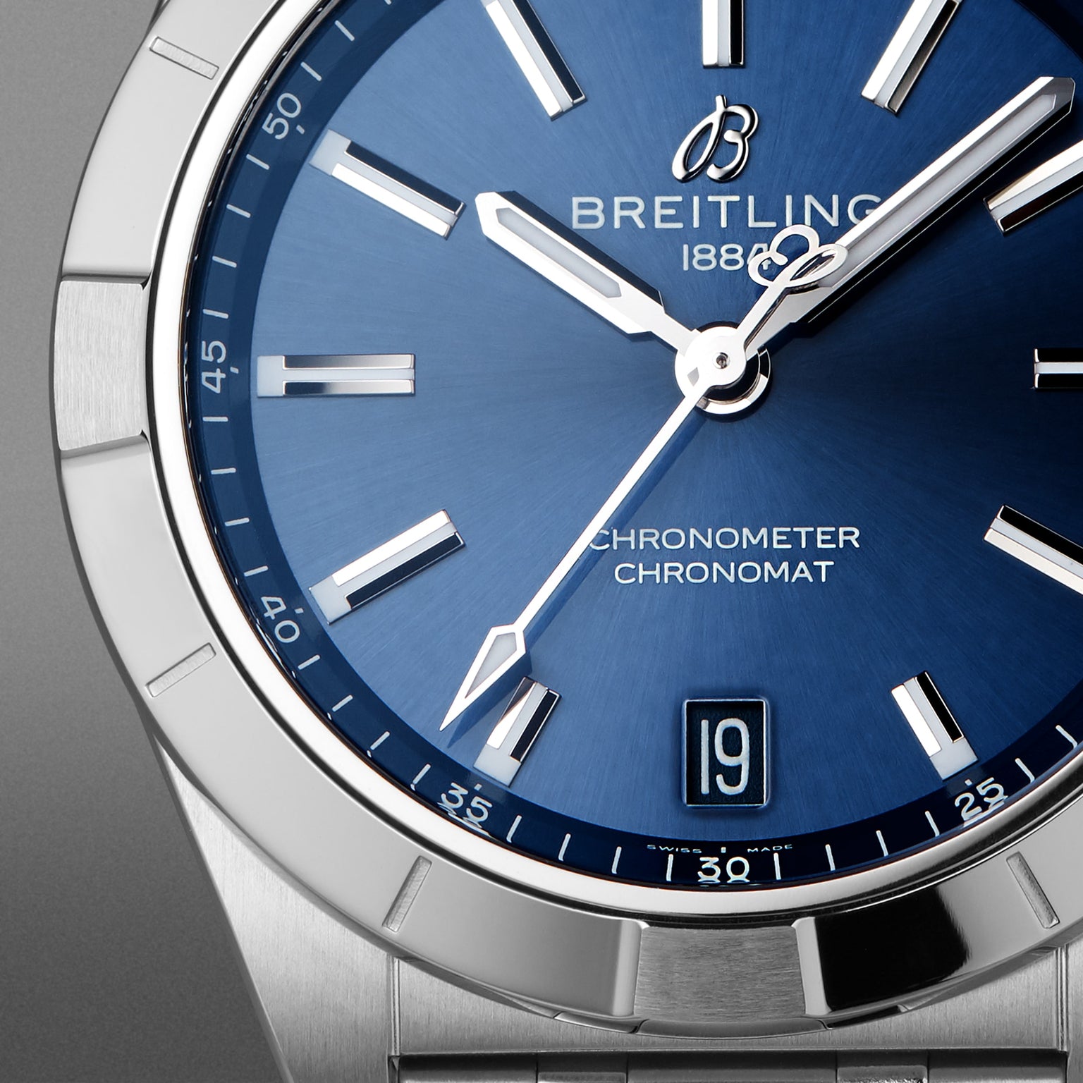 Close-up of the Breitling Chronomat 32 watch featuring a blue dial with silver hour markers and hands.