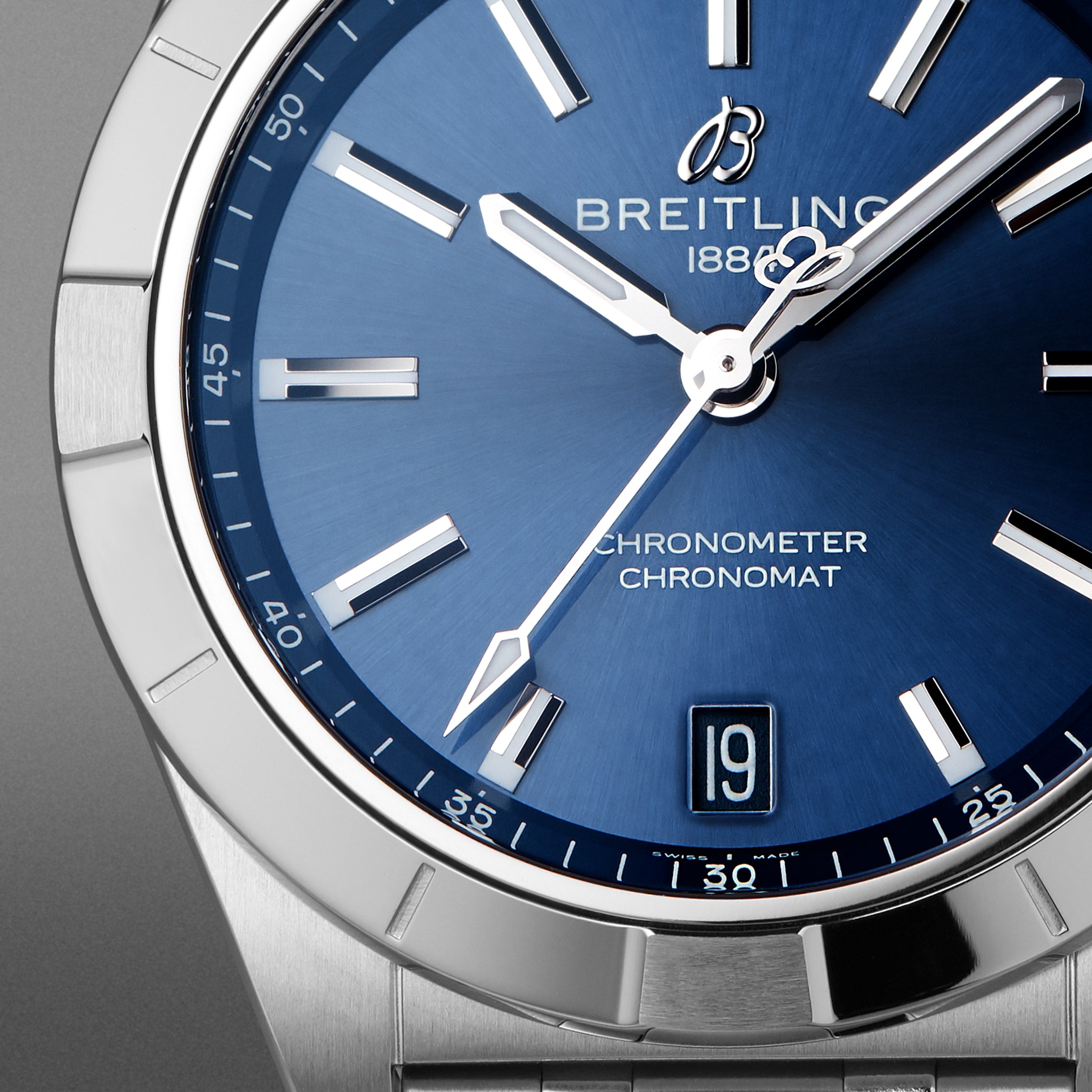 Close-up of the Breitling Chronomat 32 watch featuring a blue dial with silver hour markers and hands.