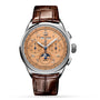 The Breitling Premier B25 Datora 42 is a luxury chronograph featuring a brown leather strap, salmon dial, three subdials, tachymeter scale, 18K red gold case, and a moonphase at 6 o’clock.
