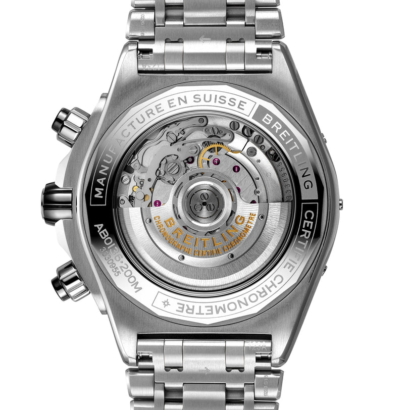Close-up of the back of a Breitling Super Chronomat B01 44, showing its transparent case that reveals the detailed Breitling 01 movement and engraved metal casing.