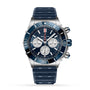 The Breitling Super Chronomat B01 44 features a blue and silver case, three subdials, a blue bezel, and a textured blue rubber strap, displayed against a white background.