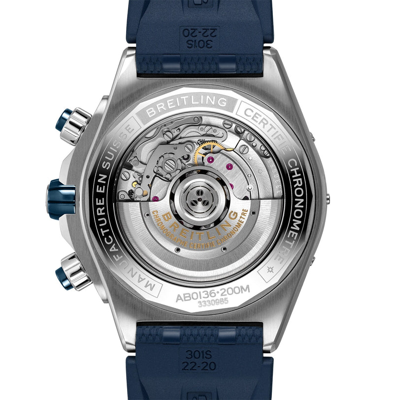 Close-up view of the back of the Breitling Super Chronomat B01 44, highlighting its exposed mechanical chronograph movement, chronograph buttons, and engraved specifications on the stainless steel case.
