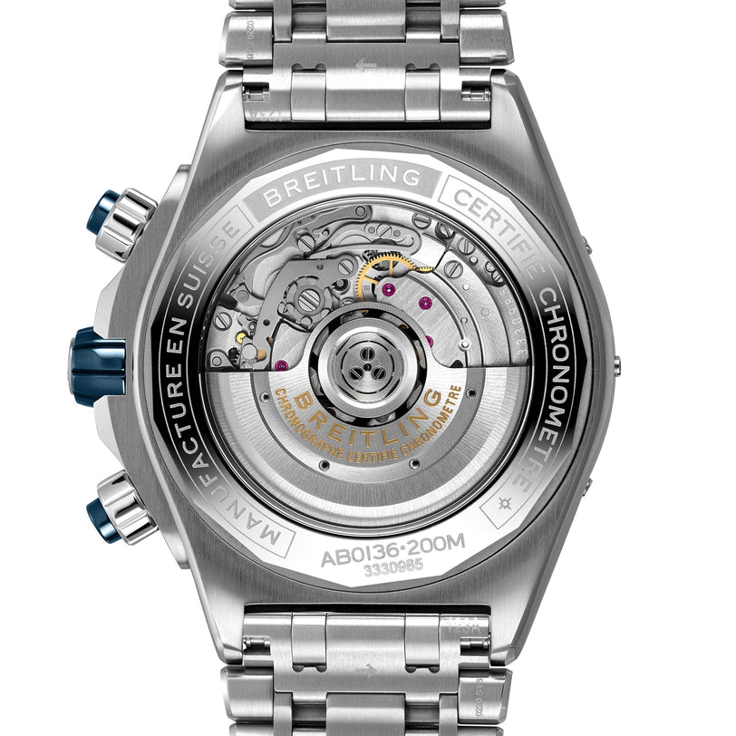 Back view of the Breitling Super Chronomat B01 44 wristwatch featuring an exposed mechanical chronograph movement, intricate engravings, and a polished metal bracelet.
