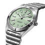 The Breitling Chronomat 32 is a stainless steel wristwatch featuring a mint green dial, silver hour markers, date display at 6 o’clock, and Breitlings signature Rouleaux bracelet.