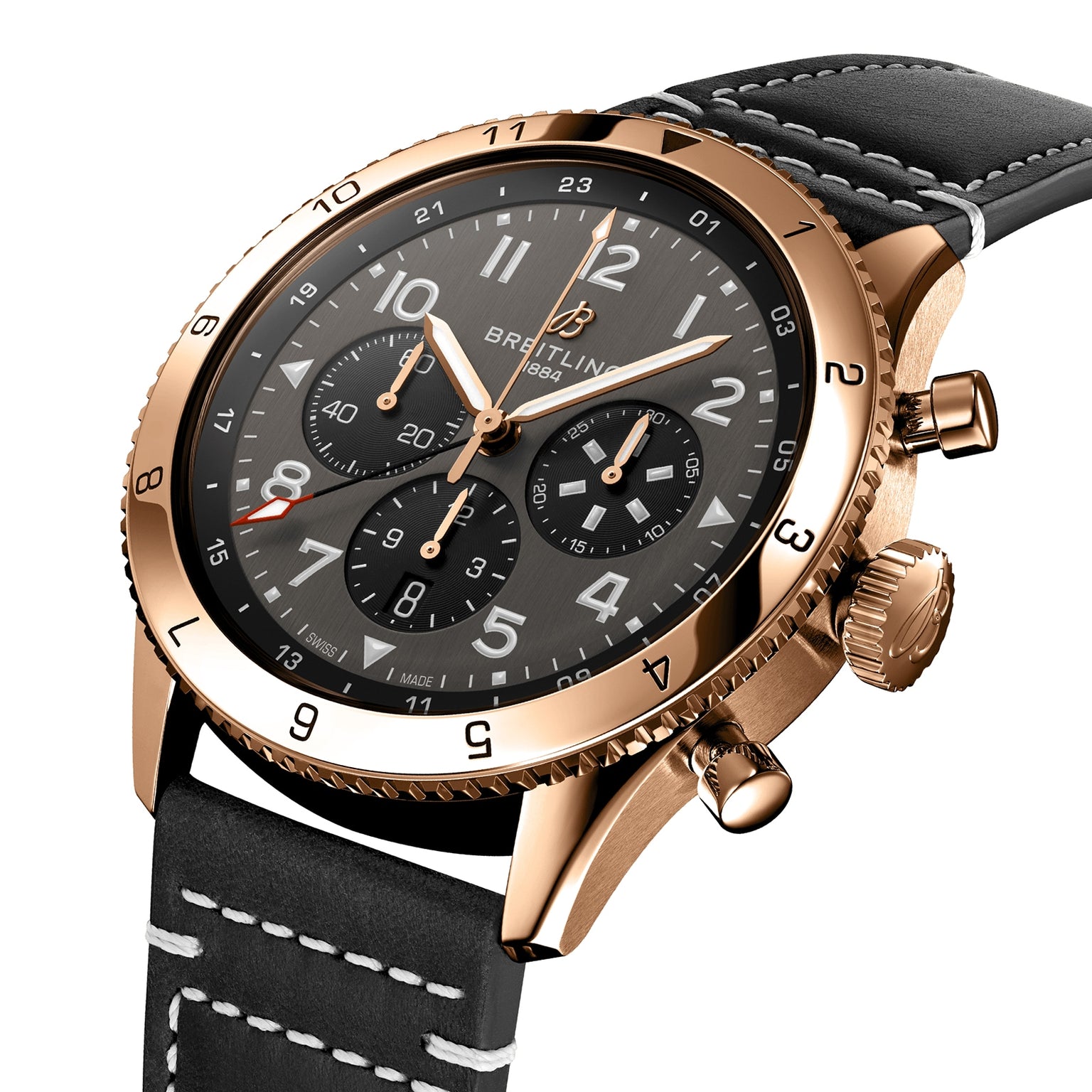 The Breitling Super AVI B04 Chronograph GMT 46 P-51 Mustang features a gold case, black dial with three subdials and white numerals, plus a black leather strap with white stitching—a tribute to aviation heritage for watch enthusiasts.