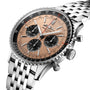 Close-up of the Breitling Navitimer B01 Chronograph 43 with a beige dial, black subdials, stainless steel bracelet, ridged bezel, and precision-engineered Breitling 01 calibre.