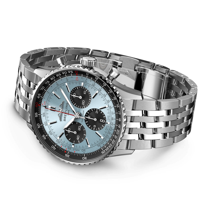 The Breitling Navitimer B01 Chronograph 43 is a stainless steel pilots watch with a light blue dial, three black subdials, a red second hand, and link bracelet, powered by the renowned Breitling 01 calibre and displayed at an angle.