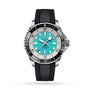 The Breitling Superocean Automatic 44 features a turquoise dial, black and silver bezel, stainless steel case, black rubber strap, and silver hour markers on a white background.