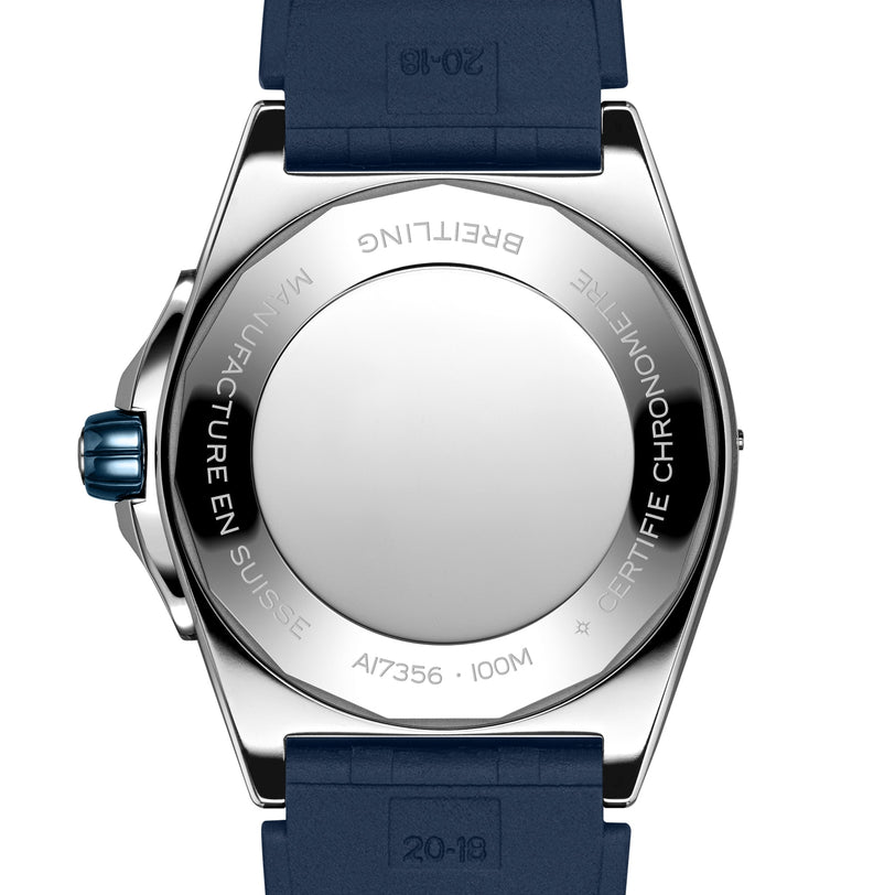 Back view of the Breitling Super Chronomat Automatic 38, featuring a stainless steel case, blue crown and strap, engraved markings, and reflections of its ice blue dial and diamond-set bezel in the detailed design.