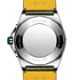 The back view of a Breitling Super Chronomat Automatic 38 features a yellow strap, green crown, and an engraved metal case back displaying its mechanical certification, serial info, and Breitling 17 calibre.