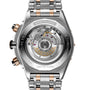 Close-up view of the Super Chronomat B01 44 case back by Breitling, featuring the exposed Breitling Manufacture 01 Movement and engraved brand markings on a two-tone metal bracelet.