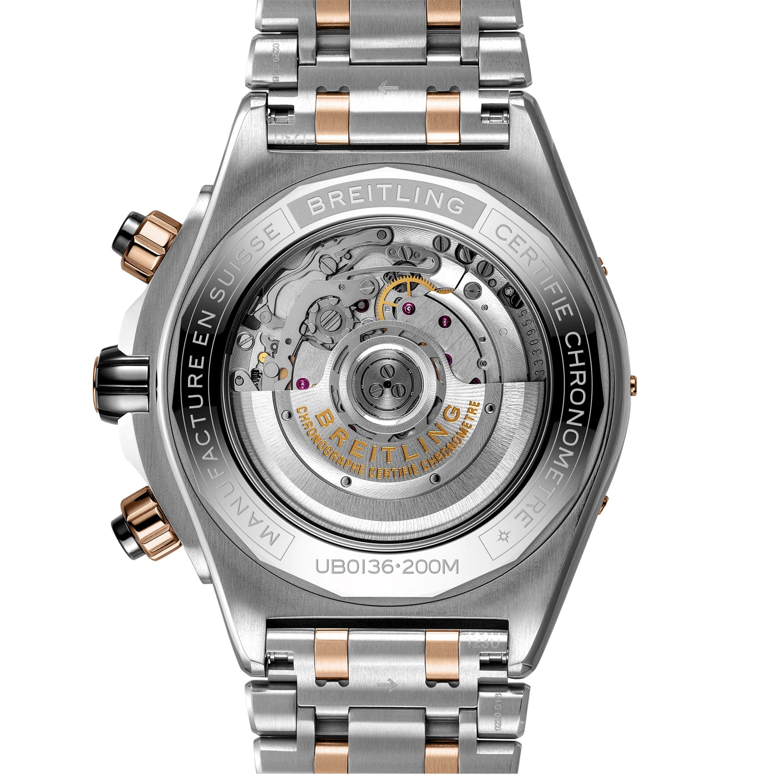 Close-up of the back of a Breitling Super Chronomat B01 44, displaying its exposed automatic movement and engraved details on a silver and 18ct rose gold bracelet.