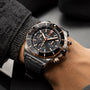 A close-up of a person wearing a Breitling Super Chronomat B01 44 mechanical chronograph with a black strap and textured sleeve visible.