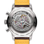 Close-up of the transparent case back on the Breitling Top Time B01 Ford Mustang, revealing the intricate Breitling Manufacture Calibre 01 movement with labeled components and a yellow and brown leather strap.