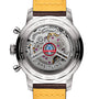 The back of the Breitling Top Time B01 Shelby Cobra chronograph showcases the Manufacture Calibre 01 movement, a Shelby Cobra logo, Swiss Made engraving, and a yellow and brown leather strap.