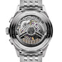 Close-up of the Breitling Premier B01 Chronograph 42, showing its exposed mechanical movement with detailed gears and a labeled rotor, all within a stainless steel case engraved with text.