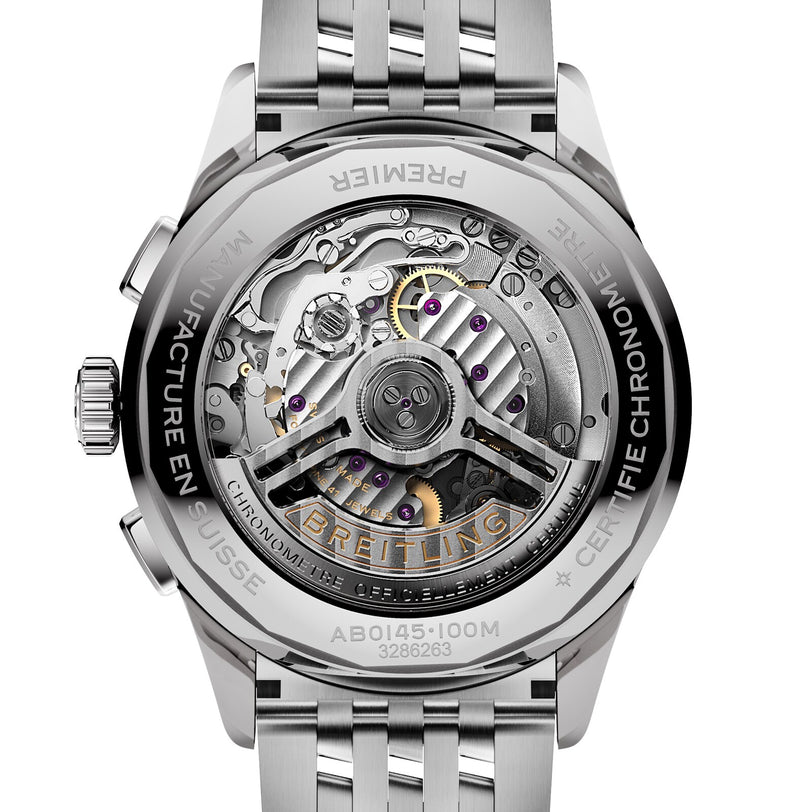 Close-up of the Breitling Premier B01 Chronograph 42, highlighting its intricate mechanical movement and engraved details visible through a transparent case back set in refined stainless steel.