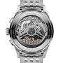 Close-up of the Breitling Premier B01 Chronograph 42, highlighting its intricate mechanical movement and engraved details visible through a transparent case back set in refined stainless steel.