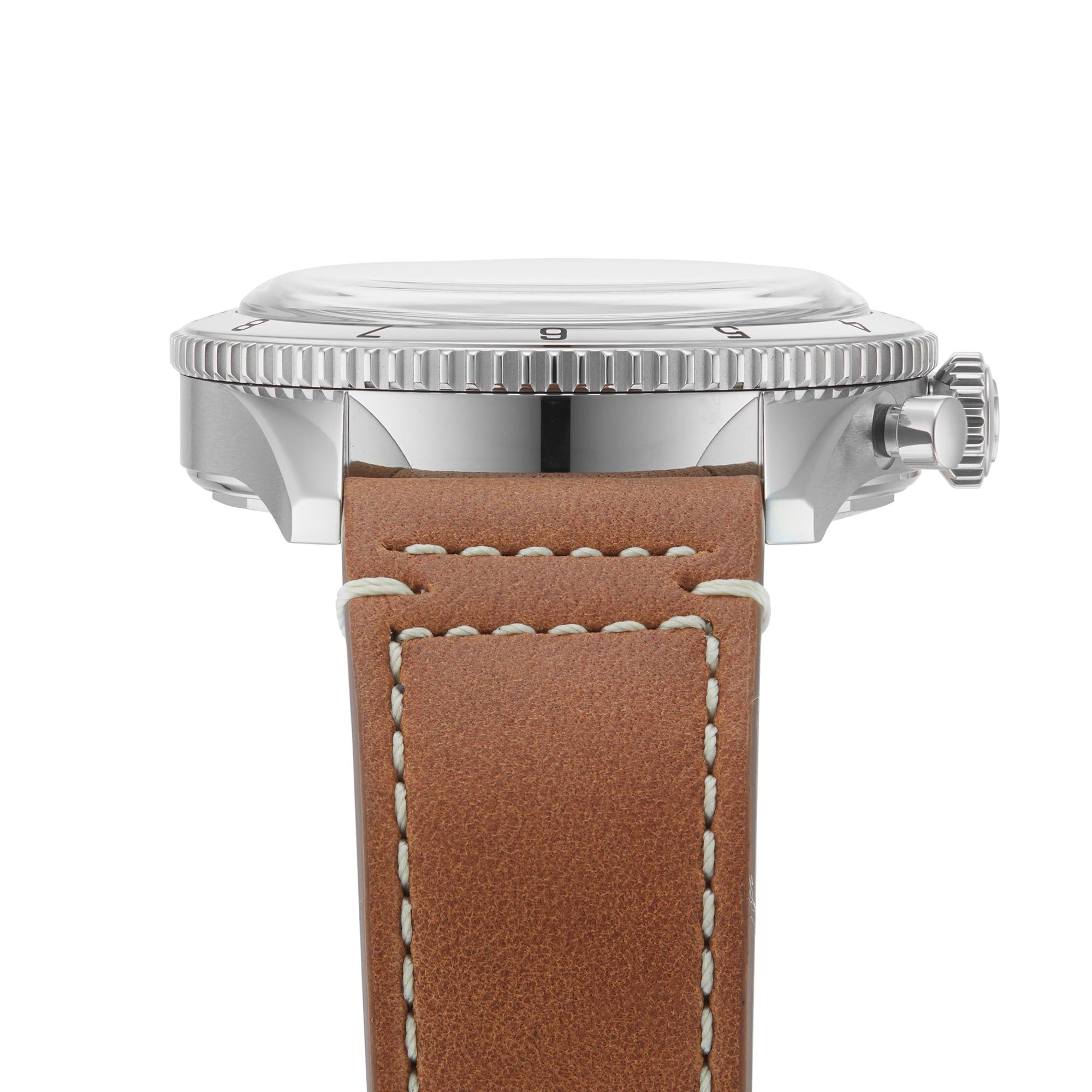 Close-up side view of the Breitling Classic AVI Chronograph 42 P-51 Mustang with a polished metal case, grooved bezel, and brown leather strap with white stitching, highlighting the precise chronograph movement.