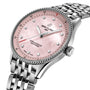 The Breitling Navitimer 32 is a silver chronometer watch featuring a stainless steel case, pink mother-of-pearl dial, diamond hour markers, and a stainless steel link bracelet.