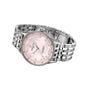 The Breitling Navitimer 32 is a silver wristwatch with a stainless steel case, metal link band, pink mother-of-pearl dial with diamond hour markers, date window, and textured bezel.