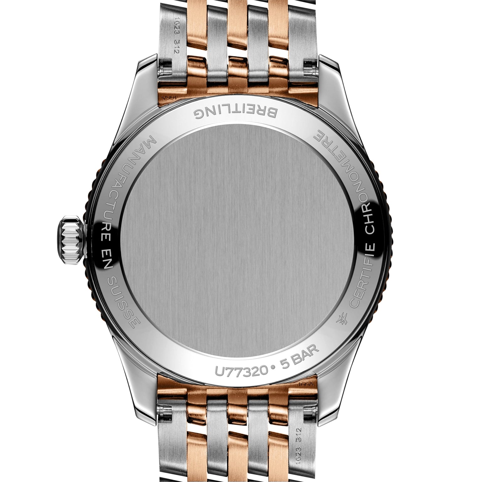 Close-up view of the back of a Breitling Navitimer 32 wristwatch featuring a silver and 18K red gold metal bracelet and engraved detailing around the case edge.