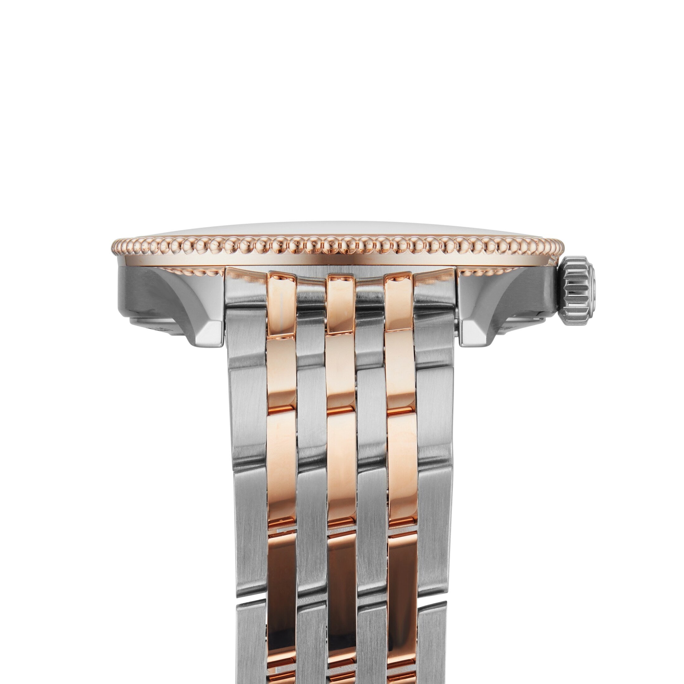 Close-up side view of the Breitling Navitimer 32, highlighting its two-tone metal bezel, crown, and interwoven silver and 18K red gold bracelet links.