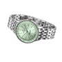 A Breitling Navitimer Automatic 36 wristwatch with a mint green dial, silver hour markers, red accents, and a stainless steel link bracelet is displayed at an angle on a white background.