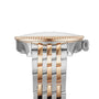 Close-up side view of the Breitling Navitimer Automatic 36, featuring a silver and gold two-tone metal band, a ribbed bezel, and the crown on the right side.