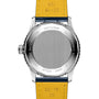 Back view of the Breitling Navitimer Automatic 41 showing its metal case back with engraved branding, certification details, model number, and a yellow leather strap, powered by the Breitling 17 calibre.