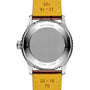 The image shows the back of a 41mm Breitling Navitimer Automatic GMT with a stainless steel case, yellow leather strap, and engraved details on the case and strap.