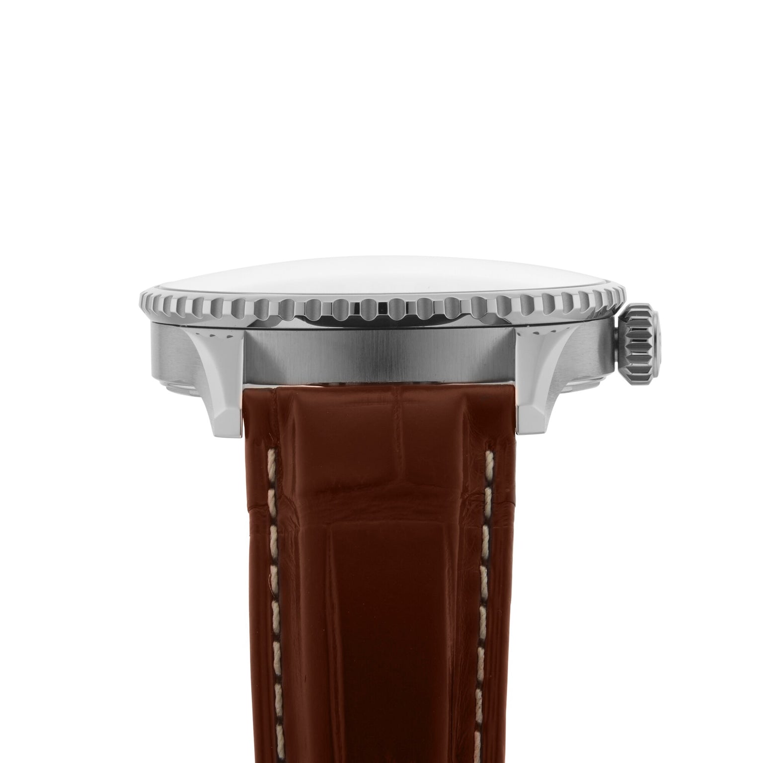 Side view of the Breitling Navitimer Automatic GMT 41, showcasing its 41mm stainless steel case, textured bezel, crown, and brown leather strap with white stitching inspired by classic aviator style.