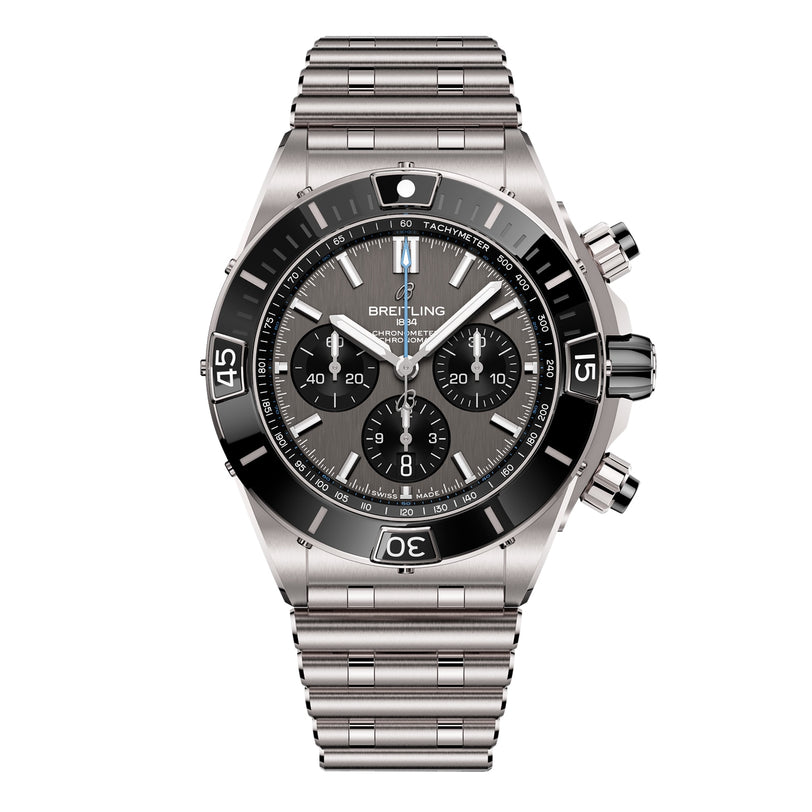 The Breitling Super Chronomat B01 44 is a stainless steel chronograph watch with a black bezel, three subdials, tachymeter markings, and a metal bracelet, powered by the precise Breitling 01 calibre and shown against a white background.