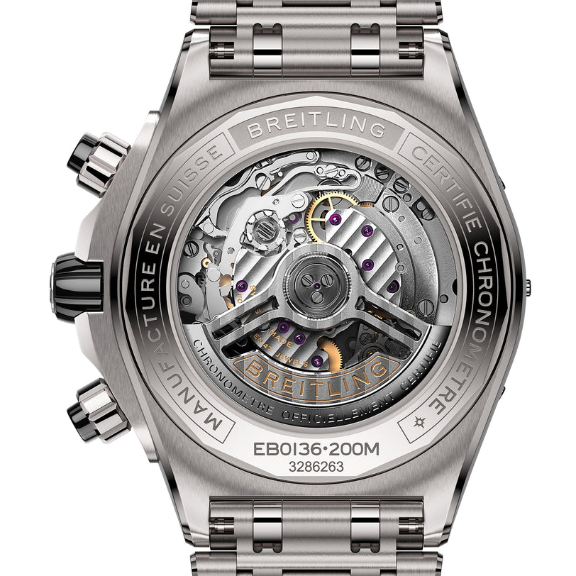Close-up of the Super Chronomat B01 44 by Breitling, showing its titanium case back with engraved text and a transparent window displaying the detailed Breitling 01 calibre movement.