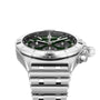 A Breitling Chronomat B01 42 The Watches Of Switzerland Group Centenary Exclusive wristwatch with a green dial, silver bezel, and metal link bracelet featuring the B01 Manufacture Calibre, shown on a white background.