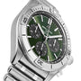 A Breitling Chronomat B01 42 The Watches Of Switzerland Group Centenary Exclusive stainless steel chronograph wristwatch with a green dial, three black subdials, and metal link bracelet, viewed at an angle.