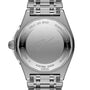 The back of a Breitling Chronomat Automatic GMT 40 Giannis Antetokounmpo wristwatch showcases engraved text, a signature, and serial numbers on its stainless steel case with the watch band attached.