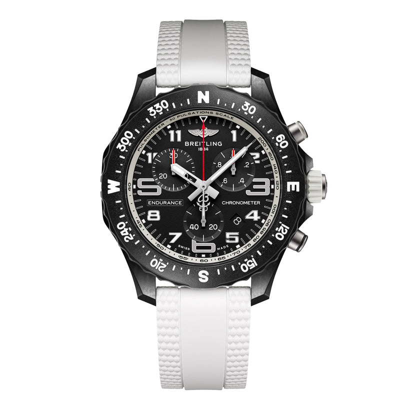 The Breitling Endurance Pro 38 athleisure watch features a black dial with white markers, sports chronograph functions, a rotating bezel, durable Breitlight case, and a white textured rubber strap.