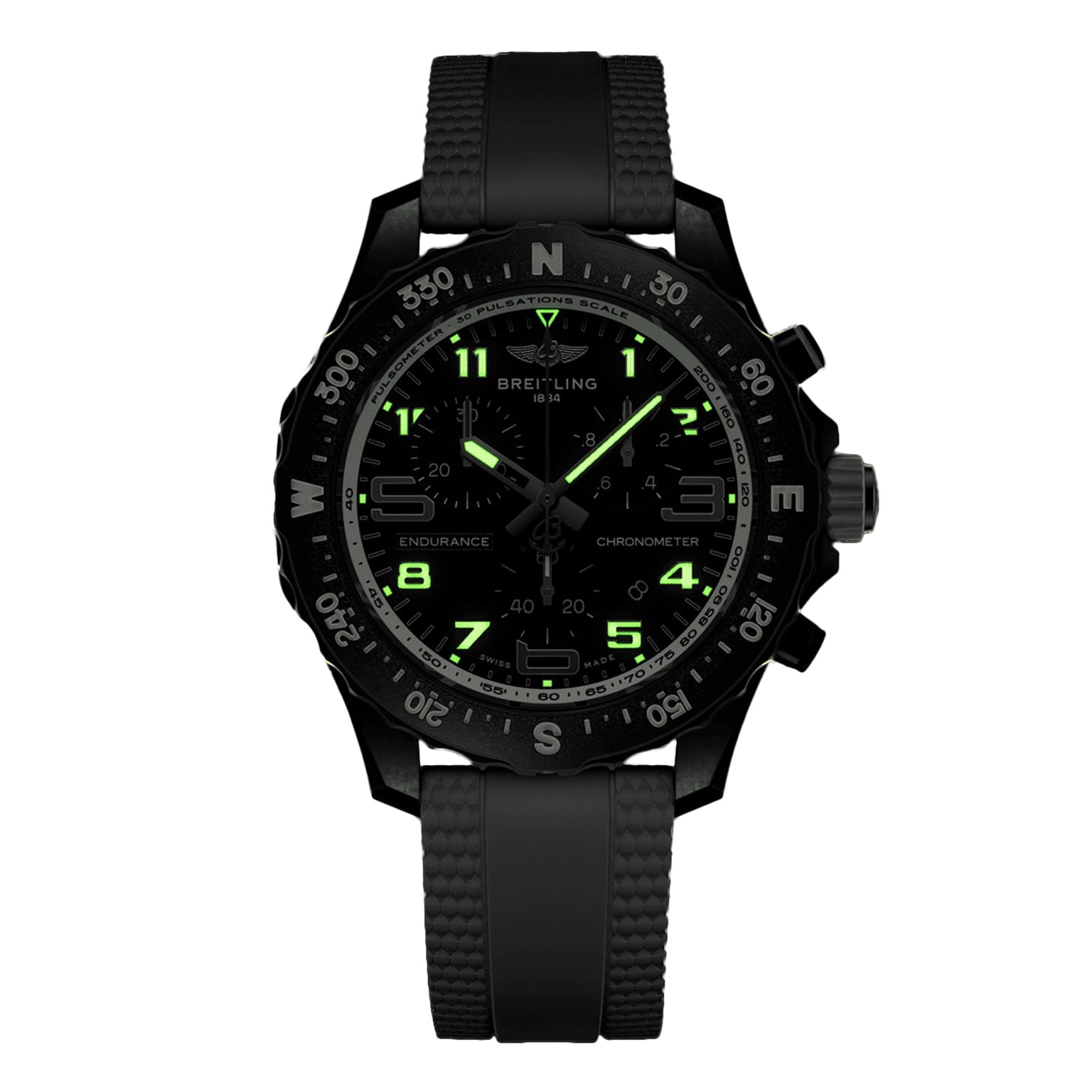 A black Breitling Endurance Pro 38 sports chronograph with neon green numerals, black rubber strap, Breitlight case, and compass bezel is shown on a white background.