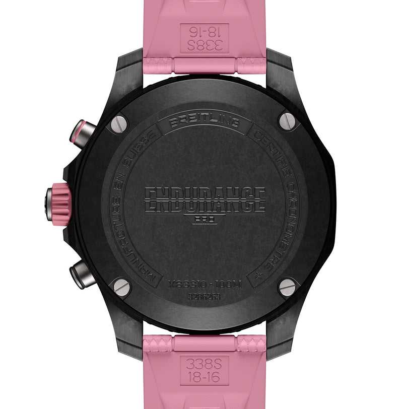Close-up of the back of a black Breitling Endurance Pro 38 watch with a pink strap.