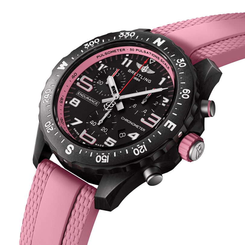 The Breitling Endurance Pro 38 is an athleisure watch in black and pink, featuring a textured pink rubber strap, durable Breitlight case, and a sleek black bezel.