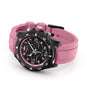 The Breitling Endurance Pro 38 is shown on a white background, featuring a black dial, black bezel, pink accents, a pink textured silicone strap, and a durable Breitlight case.