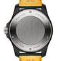Back view of the Breitling Avenger Automatic GMT 44 Night Mission, showing engraved model details, serial number, and water resistance rating, paired with a yellow military leather strap inspired by aviation heritage.