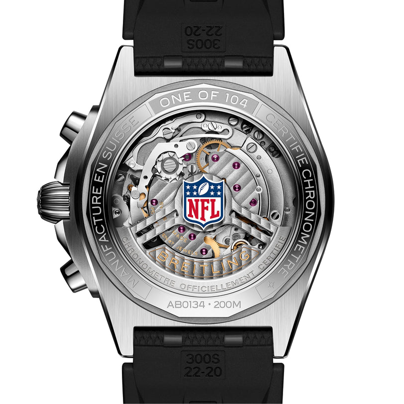 Close-up of the Breitling Chronomat B01 42 NFL New England Patriots Edition watch back, displaying intricate gears and the NFL logo at the center.