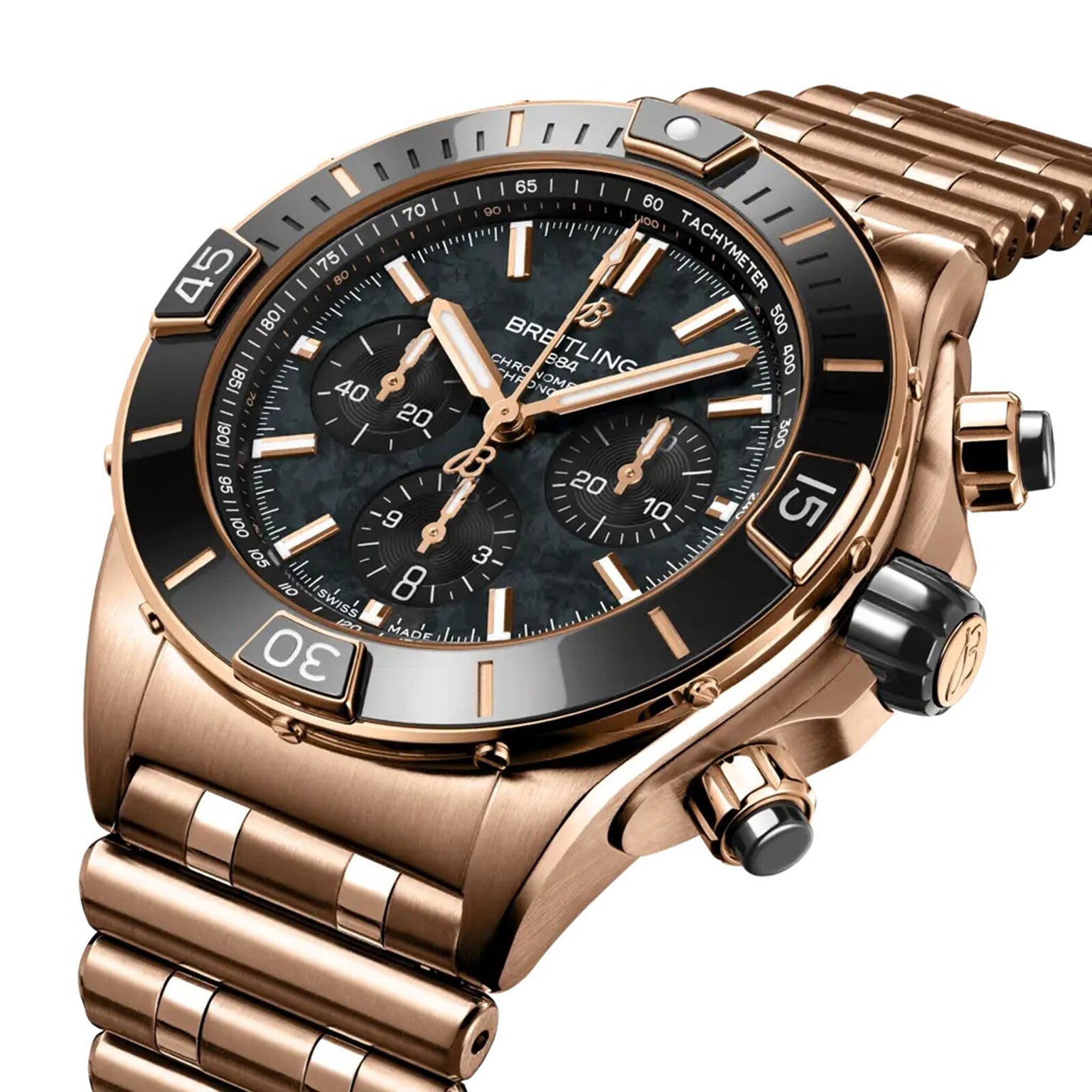 A close-up of the Breitling Super Chronomat B01 44, featuring a rose gold case, black bezel and dial, three subdials, and a metal link bracelet.