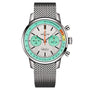 The Breitling Top Time B01 Fausto Coppi is a silver chronograph watch with a mesh strap, white dial with two subdials, green and orange accents, and COSC-certified precision.