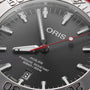 Close-up of the Oris Aquis Date Relief watch face, showing the brand name, date at 6 o’clock, and 30 bar/300 m water resistance—a true diver’s timepiece.